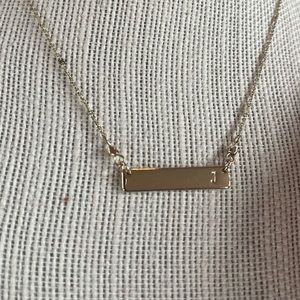 Gold plated bar necklace with initial “J”. Adjustable length 16-18”.